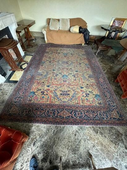 Large oriental carpet with yellow background...