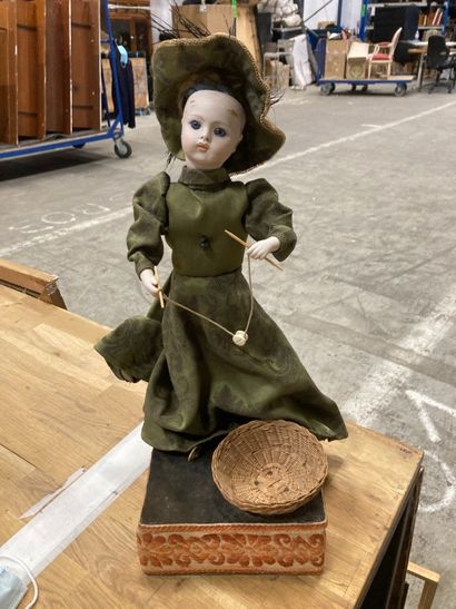 An automaton doll playing diabolo under a...