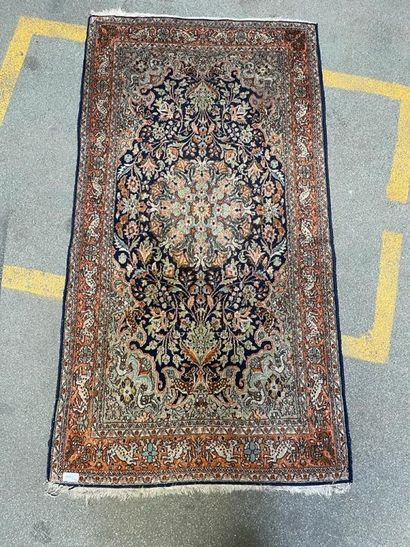 null Modern Oriental carpet in silk with blue background, gallery with ochre background...