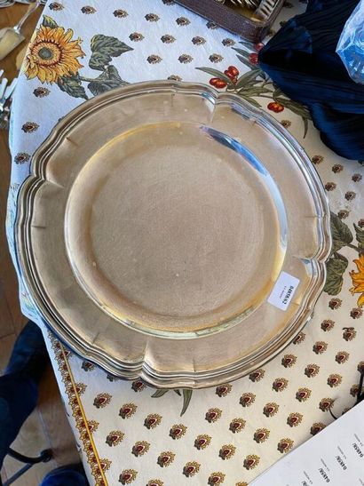 A large circular serving dish with contoured...