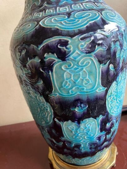 null CHINA 

A turquoise blue porcelain baluster vase on a shaded eggplant background,...