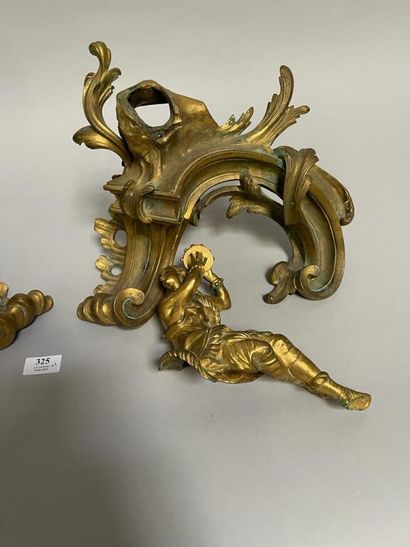 null Pair of gilt bronze and chased andirons decorated with a couple of musician.

Regency...
