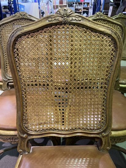 null Suite of 11 caned chairs with flat and shouldered backs in molded and carved...