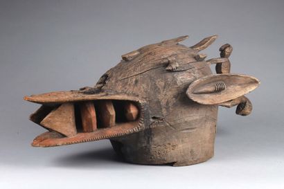 null Fire-breathing helmet mask with a muzzle showing stylized teeth. Small horns...