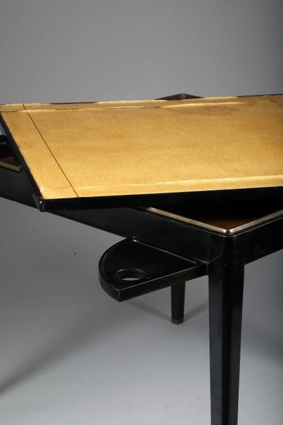 null Attributed to MAISON JANSEN.
Black lacquered wood game table with square top...