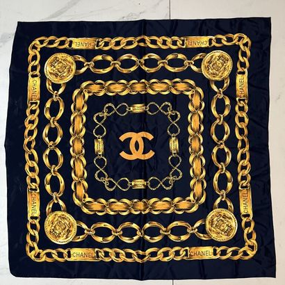 null CHANEL. 
Silk twill square with a midnight blue background decorated with golden...