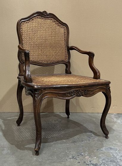 Armchair in carved and molded walnut with...