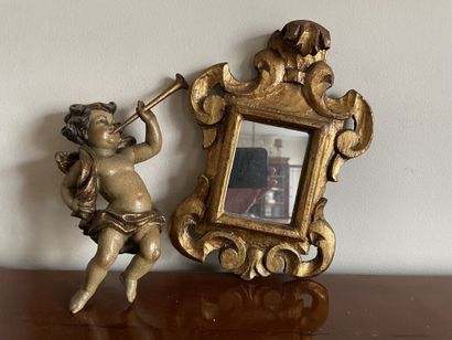 Lot in carved wood : 
- Angelot with a trumpet...