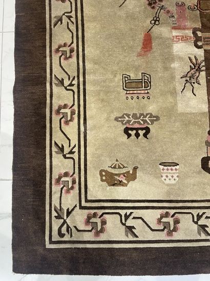null CHINA. 
Wool carpet decorated with everyday objects on a cream background. Border...