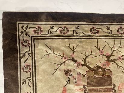 null CHINA. 
Wool carpet decorated with everyday objects on a cream background. Border...