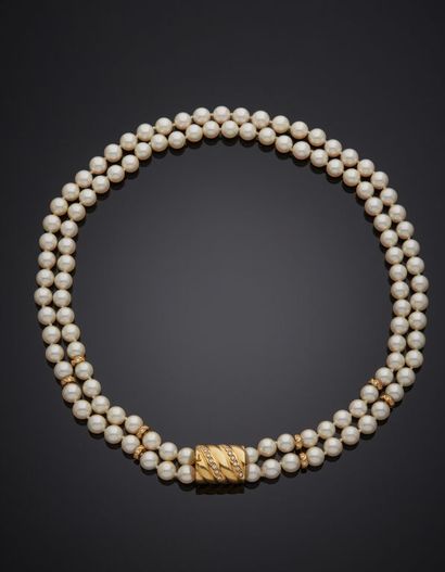 NECKLACE of two rows of akoya pearls, some...