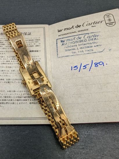 null CARTIER. Mini-tank model. 
Ladies' wristwatch in yellow gold 750 mm, bezel paved...