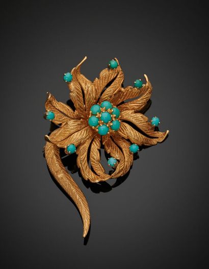 A 750 mm yellow gold brooch presenting a...