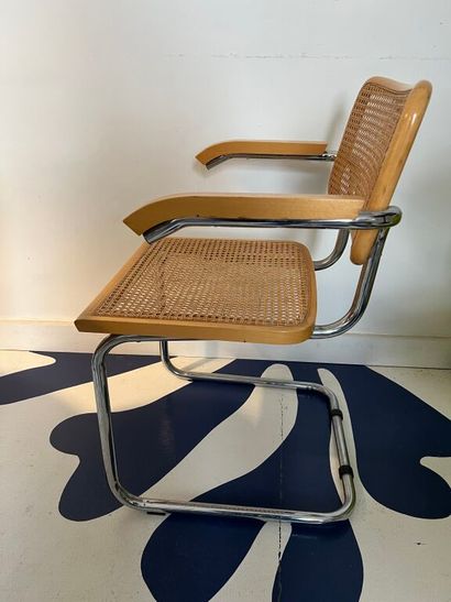 null After Marcel BREUER. 
Cesca B32" armchair in wood and chromed metal. 
Recent...