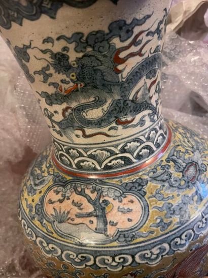 null CHINA. 
Porcelain baluster vase with polychrome decoration of Buddhist lions...
