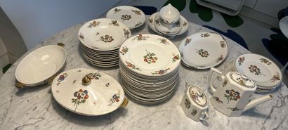 null Limoges porcelain service with polychrome and gold decoration of stylized flowers...