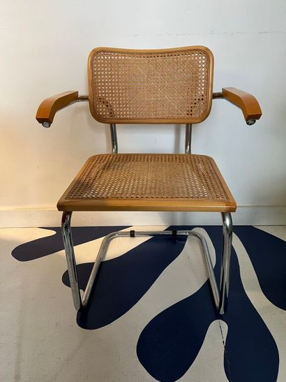 null After Marcel BREUER. 
Cesca B32" armchair in wood and chromed metal. 
Recent...