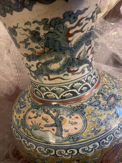 null CHINA. 
Porcelain baluster vase with polychrome decoration of Buddhist lions...
