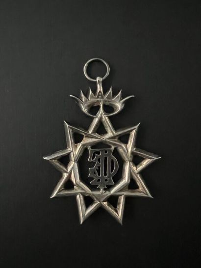 null [Freemasonry]. Masonic deputy's jewel consisting of a 9-pointed star under an...