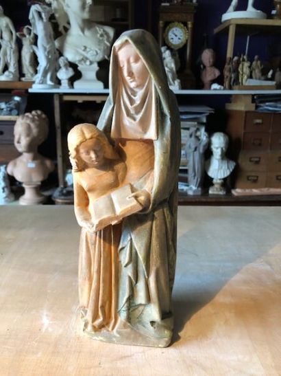 null Saint Anne reading to the Virgin.
Group in polychrome plaster.
H. 28 cm. 
(Small...