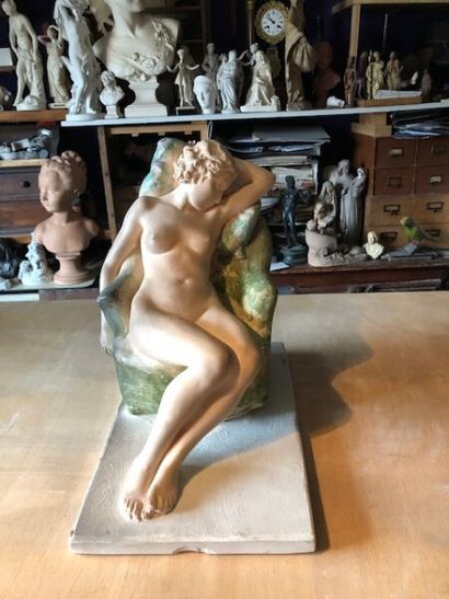 null 20th century French school. 
Nude woman kneeling on an armchair.
Group in patinated...