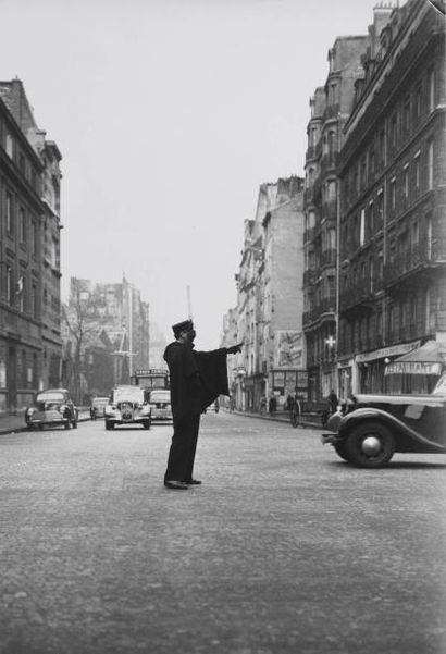 PIERRE JAHAN (1909-2003) Agent de la circulation au Boulevard Saint- Germain, Paris,...