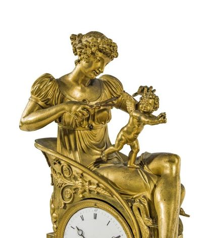 null *Pendule en bronze ciselé et doré, représentant " La coupeuse d'ailes ", jeune...