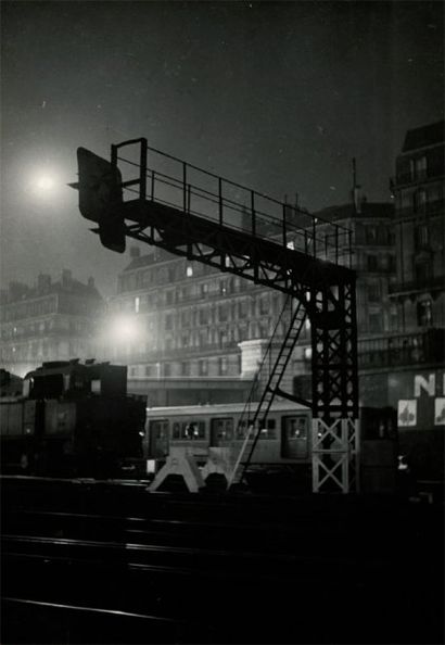 Guy Le Boyer Gare Saint-Lazare de nuit. Rails. c. 1950. Deux tirages argentiques...