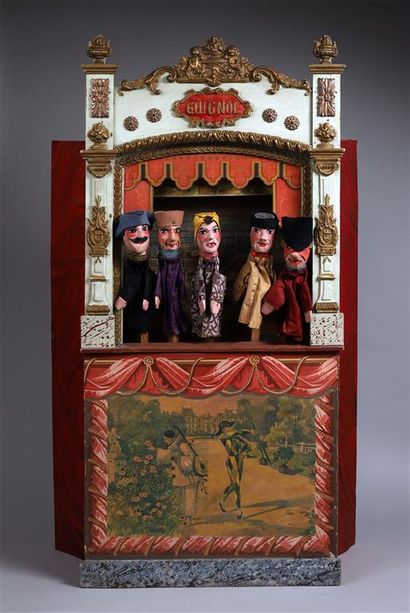 null THÉÂTRE DE GUIGNOL.
Théâtre comportant cinq marionnettes à doigt (têtes en bois...