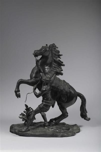 null D'après Nicolas COUSTOU (1658-1733).
Les chevaux de Marly.
Épreuve en bronze...
