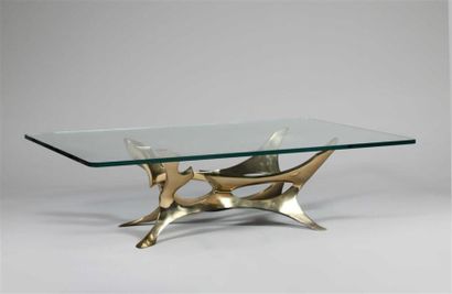 null FRED BROUARD (1944-1999).
Table basse à plateau rectangulaire en verre épais...