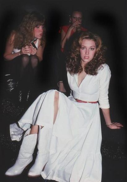  WOMAN IN WHITE DRESS, PARTY GOERS. By Rose Hartman. Studio 54. 1978. Tirage numérique...