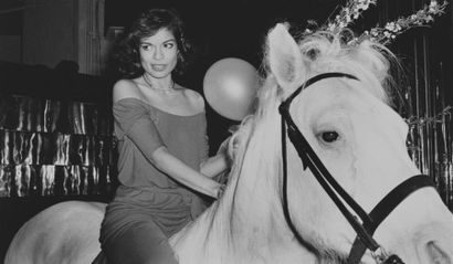 null BIANCA JAGGER ON A WHITE HORSE CELEBRATING HER BIRTHDAY.
By Rose Hartman.
Bianca...