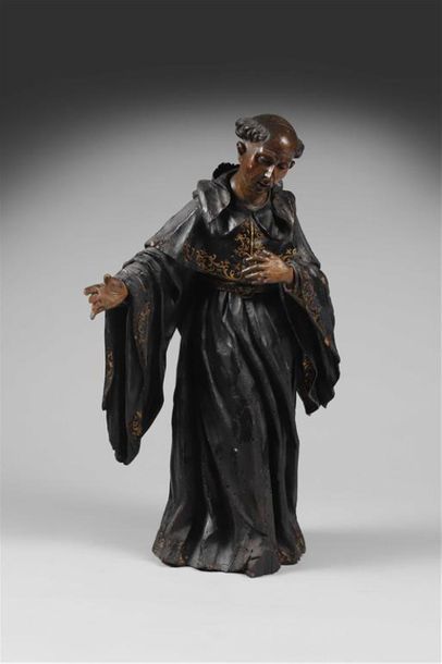 null SCULPTURE RELIQUAIRE représentant un moine en bois sculpté noirci à ornements...