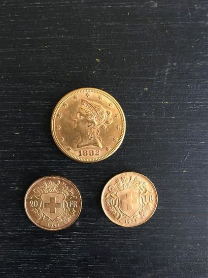 null Lot de pièces d'or comprenant : 
- 2 x 20 Frs suisses 
- 1 x 10 dollars américains.
Poids...