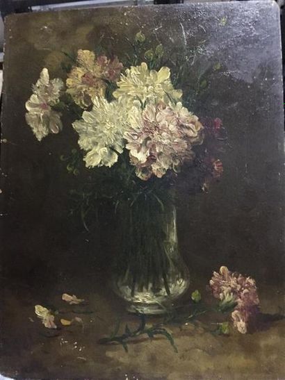 null Ecole FRANCAISE du début XXème. 
Bouquet d'oeillets dans un vase sur entrablement.
Huile...