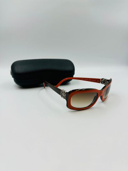null CHANEL
Pair of orange and brown sunglasses.
With case.