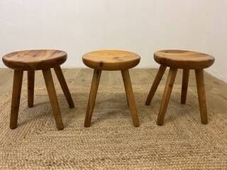  In the taste of Charlotte PERRIAND (1903-1999)
Set of three wooden stools
Circa... Gazette Drouot