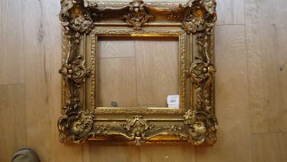 null Wooden frame and gilded stucco in the Louis XV style with shells and acanthus...