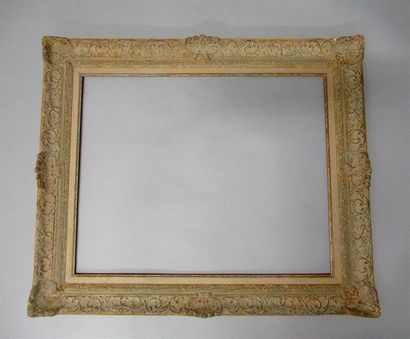 null Gilded and patinated stucco and wood frame called "Montparnasse" decorated with...
