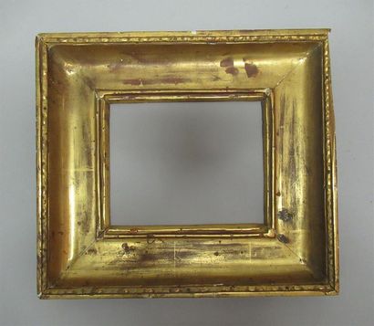 null Carved, moulded, gilded pine frame with wide throat profile and decoration of...