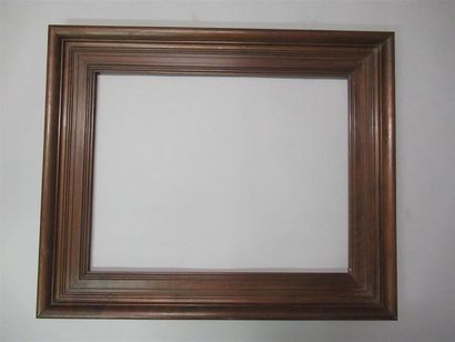 null Waxed moulded natural walnut frame with curved profile, groove, flat and soft.
XIXth...