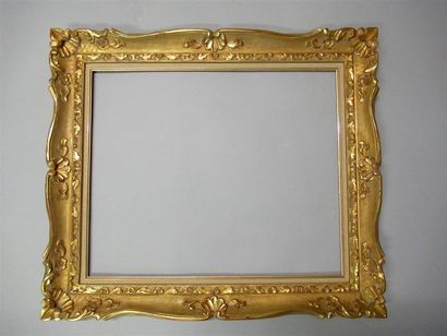 null Wood and gilded resin frame called "Montparnasse" with stylized friezes of acanthus...