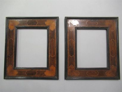 null Pair of pine frames veneered with blackened mouldings, net inlays, walnut and...