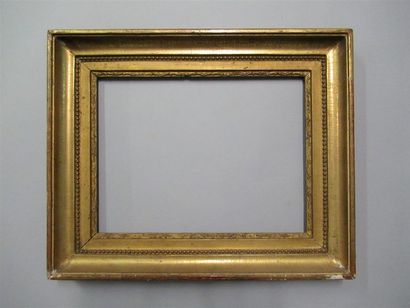 null Oak frame and gilded paste known as "with burnished throat" decorated with grapes,...