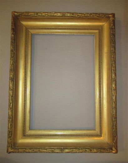 null Wooden frame and gilded stucco called "à gorge" decorated with pearl grapes...