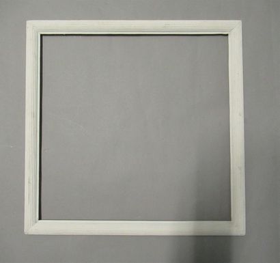 null Moulded wooden frame, repainted white with a decoration of curved grooves called...