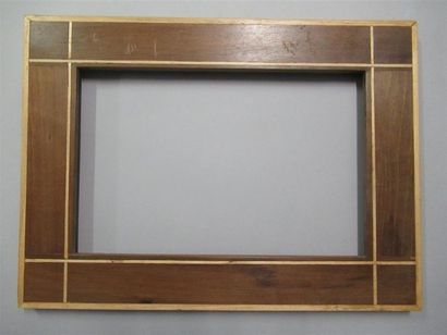 null Mahogany and light wood frame veneered on a flat profile pine core, decorated...