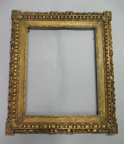 null Carved, gilded wooden frame decorated with friezes of flowers and ribbons, acanthus...