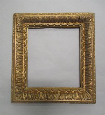 null Sculpted oak frame gilded in a mix of antique gilding with a stylized decoration...